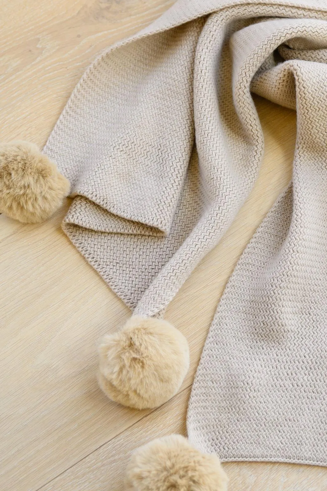 Hazel Blues® | Knitted Fuzzy Pom Pom Scarf In Beige
