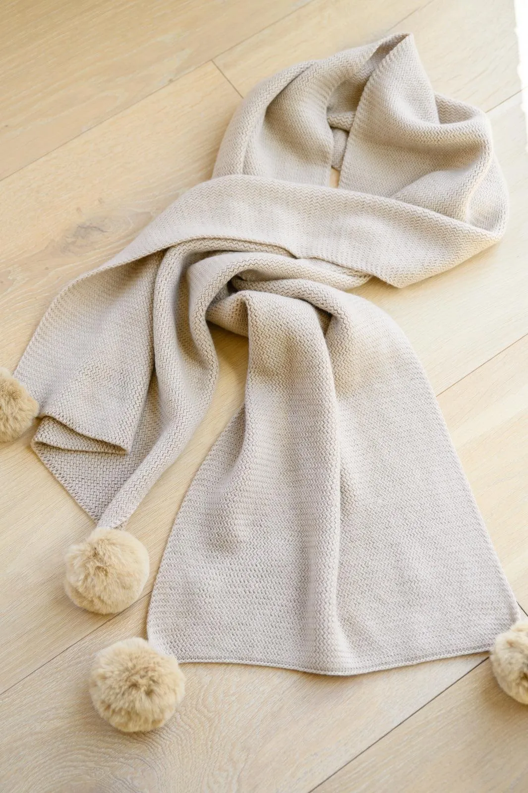 Hazel Blues® | Knitted Fuzzy Pom Pom Scarf In Beige